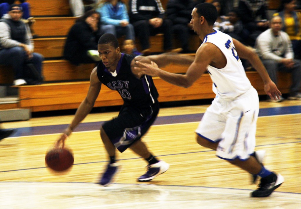 Manfred Cadet and the rest of the CCNY Men's Basketball team could not stop Lehman's second-half rally in the Beavers 74-59 loss Tuesday night. Photo by Jeff Weisinger