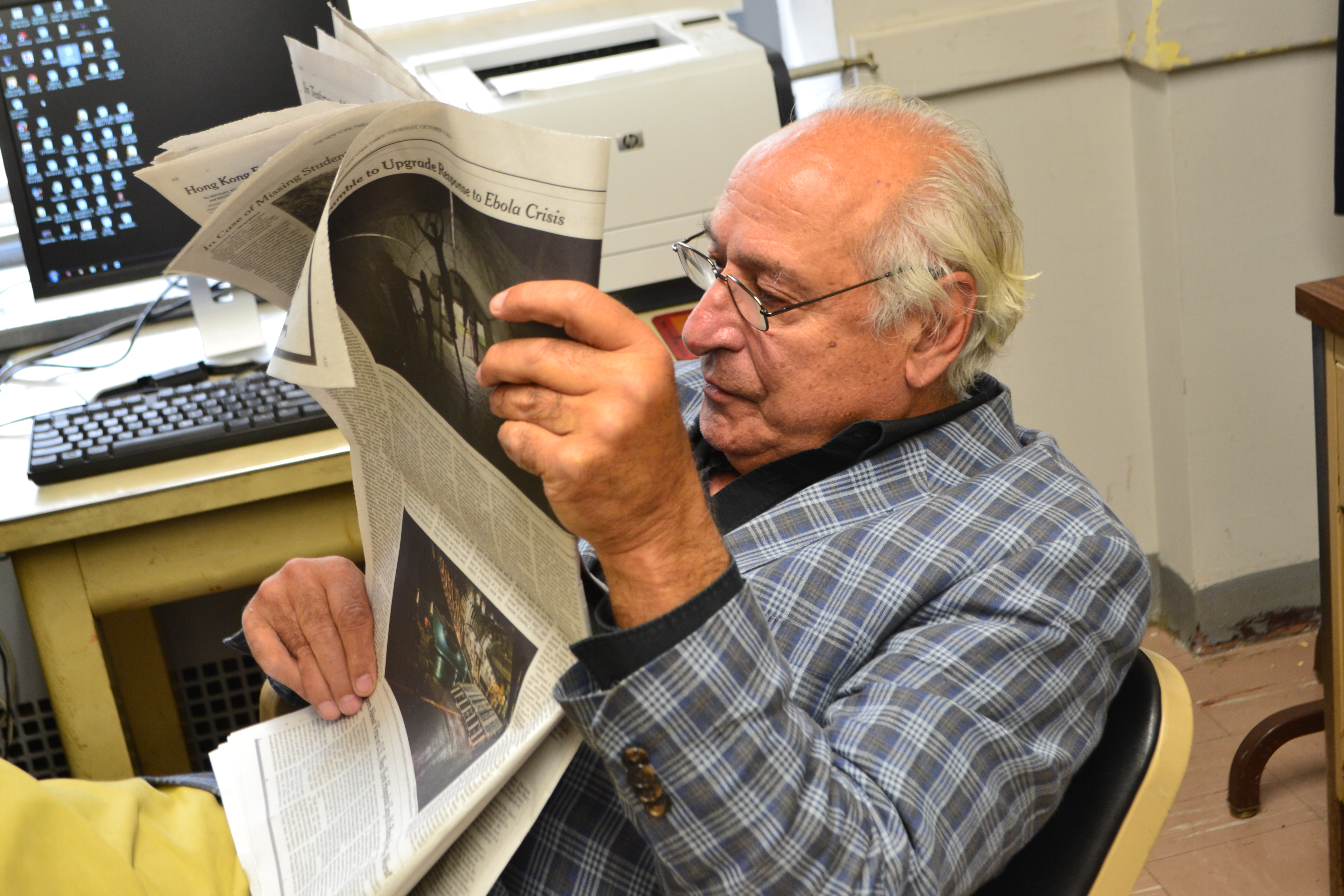 Professor Anthony Mancini may like to kick back and read a newspaper, but he is a firm believer in convergent journalism. PHOTO/ Faraz T. Toor