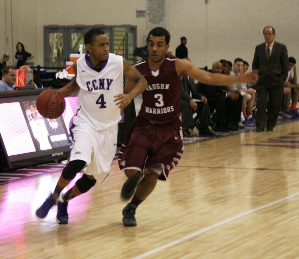 Lareik Taylor' 12 points and nine assists helps CCNY escape a late rally by Vaughn College Friday night in their 70-67 win.  Photo by Jeff Weisinger