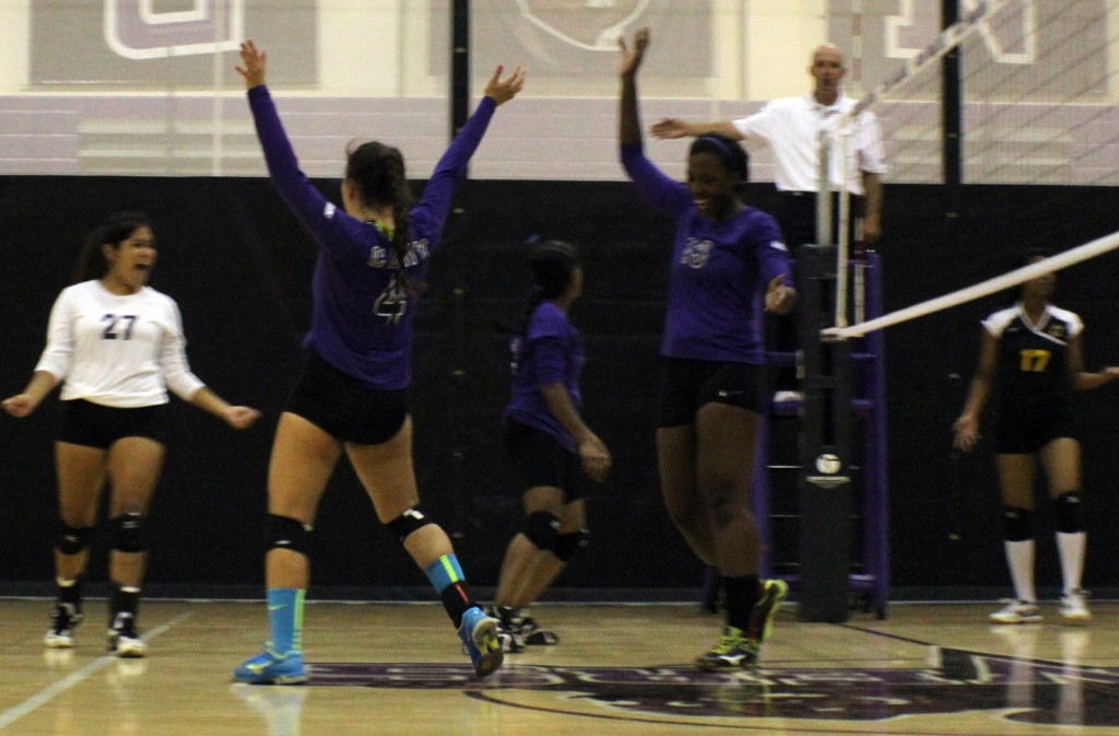 The CCNY Women's Volleyball team celebrates in the second set after rallying down six to take the lead and win the set.  Photo by Jeff Weisinger