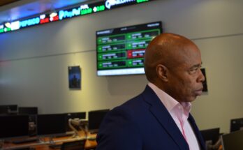 Brooklyn Borough President Eric Adams tours the new financial simulation lab at Medgar Evers College. Photo by Kevin Limiti