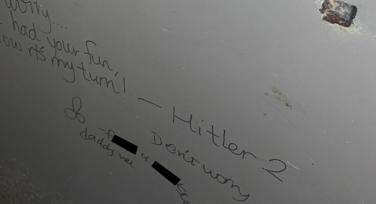 antisemitic writings on bathroom wall