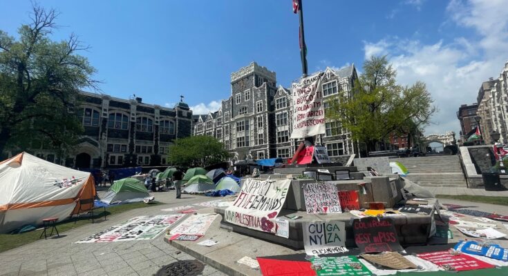 signs and tents cover the ground at City College