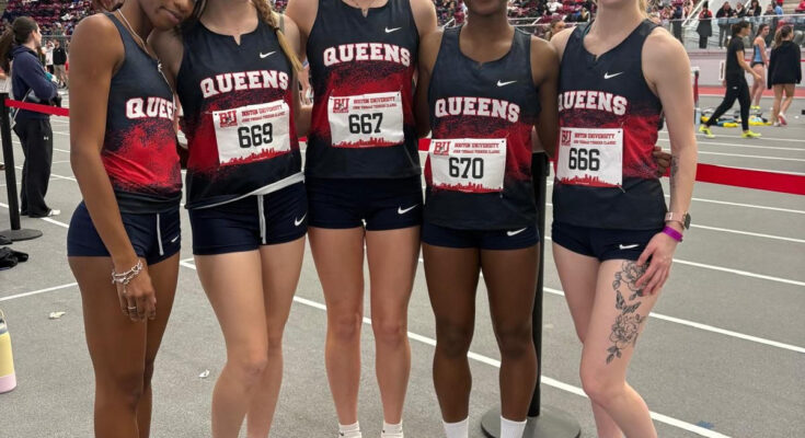 Runners from the Queens College women’s track and field team pose for a photo.