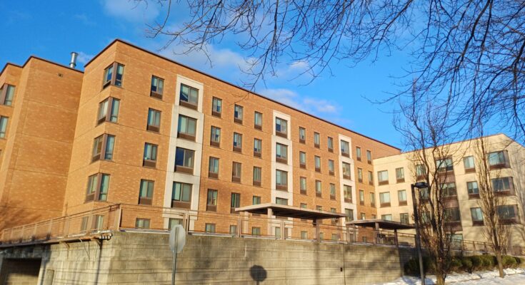 The Summit Apartments, where residents report ongoing issues including a lack of hot water and delayed responses from housing staff.