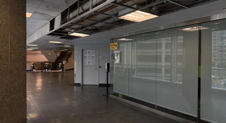 The ceiling remains open near the North Bridge at Hunter College on March 15, 2026, after a burst pipe disrupted the area.