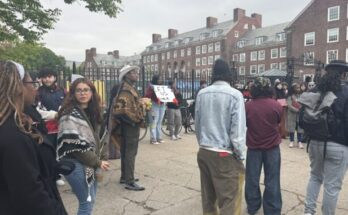 Students gather outside Bedford Gate to protest.