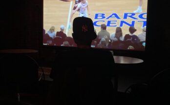 A Liberty fan watching the game at the bar Singers.