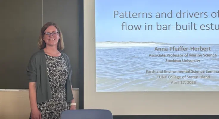 Anna Pfeiffer-Herbert stands in front of the whiteboard before her presentation.