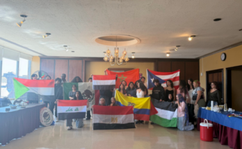 “Café Del Mundo” organizers and attendees display the flags represented in the event.